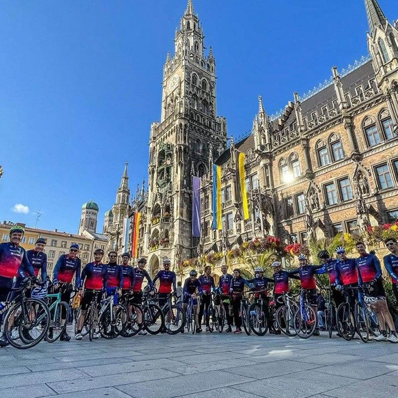 People on the bikes in front of the building