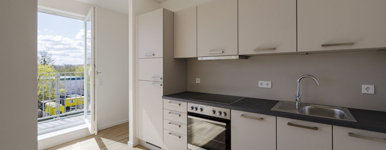 White kitchen overlooking the city