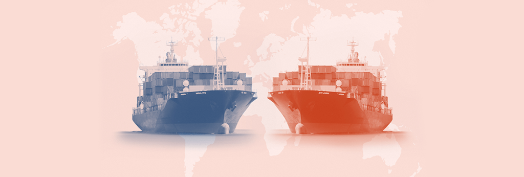 Two cargo ships on the background of the world map