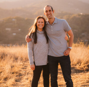 Two people standing next to each other