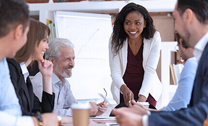 Employees discussing the strategy together at the meeting