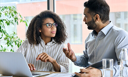 Co-workers discussing work