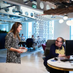 Two laughing women in the office