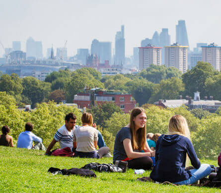 Young people sitting on the hill