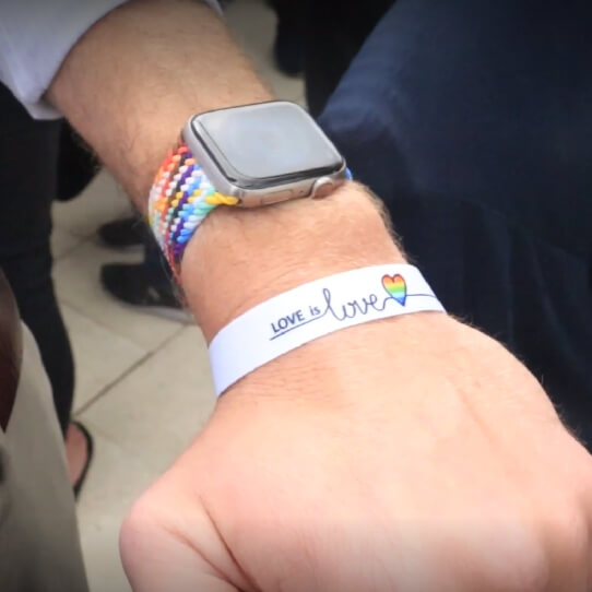 Bracelet with the words 'love is love' on the wrist