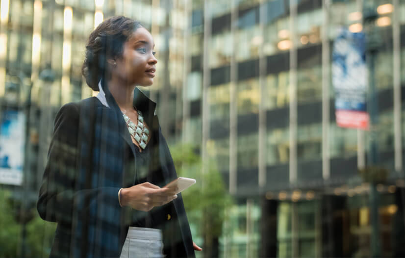 Young woman holding the phone in her hand