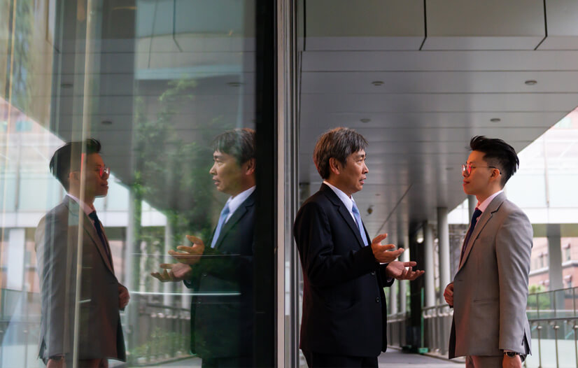 Two men in suits talking