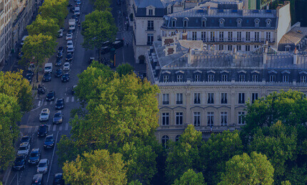 View of the building on the street surrounded by greenery