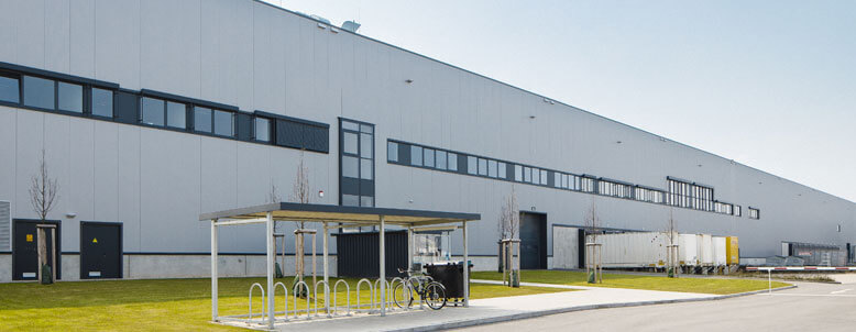 A warehouse with a front bicycle rack
