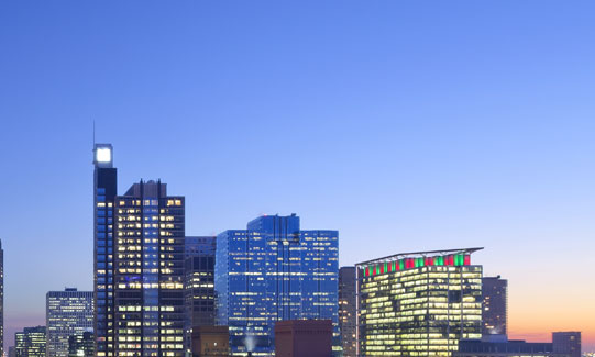 Illuminated buildings and sunset