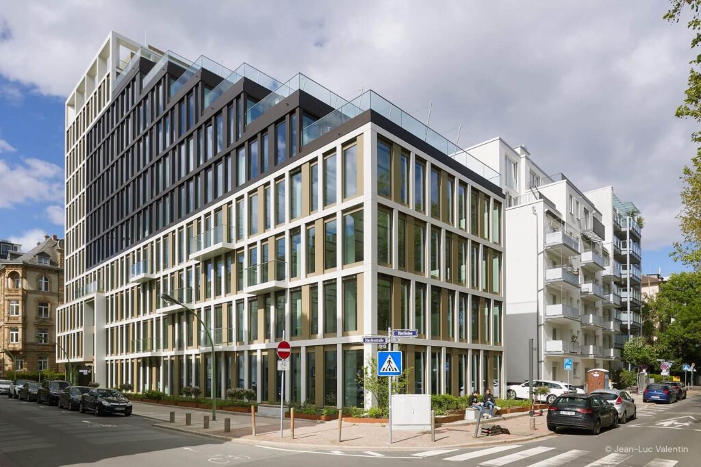 Glass building on the corner of the street