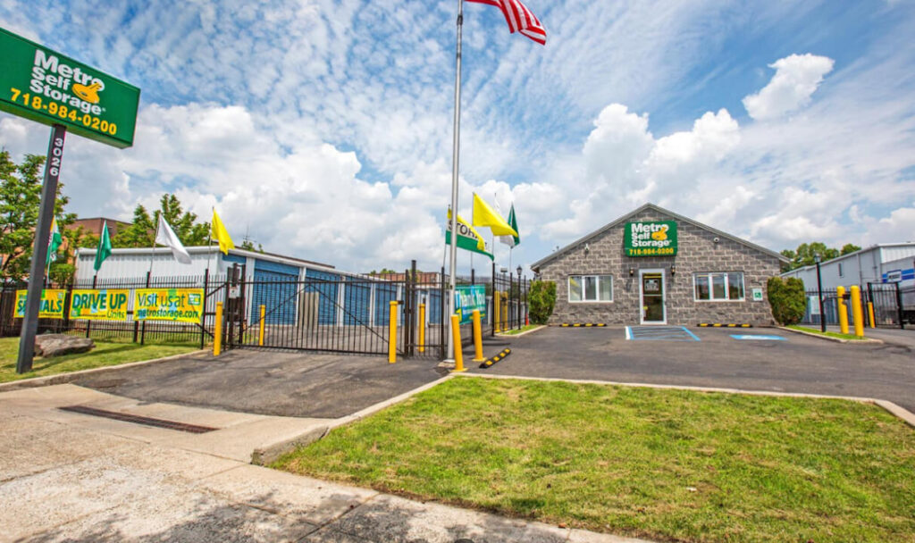 Metro Self Storage building with car park and flags at the front