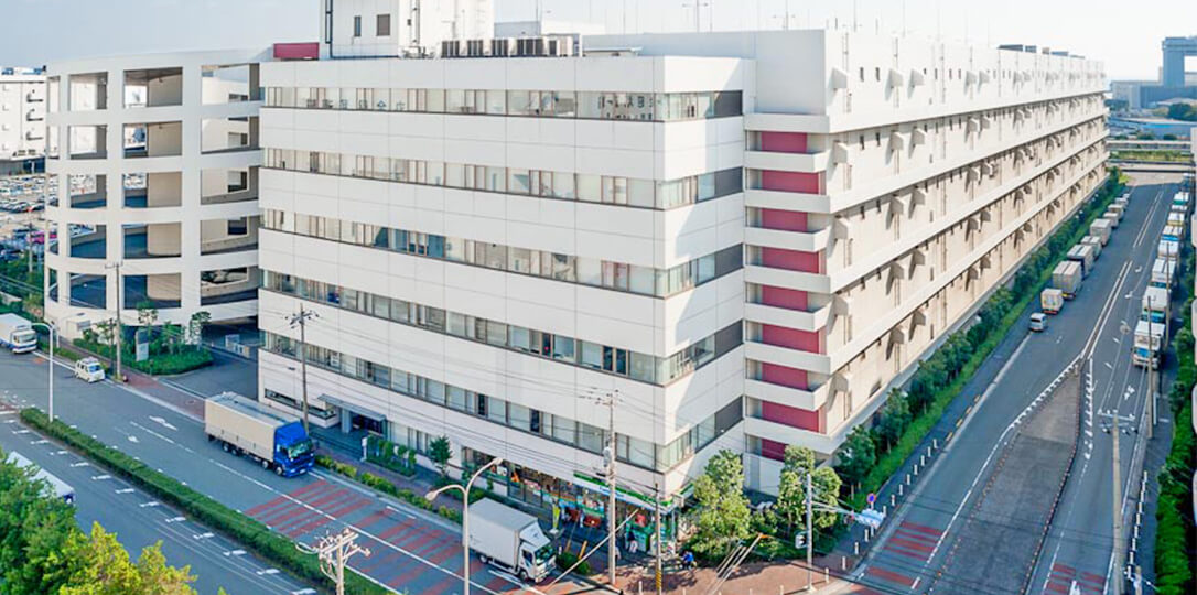 A white building on the corner of the street