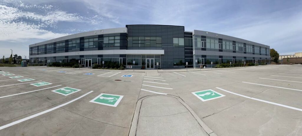 Office building and parking lot in the panoramic view