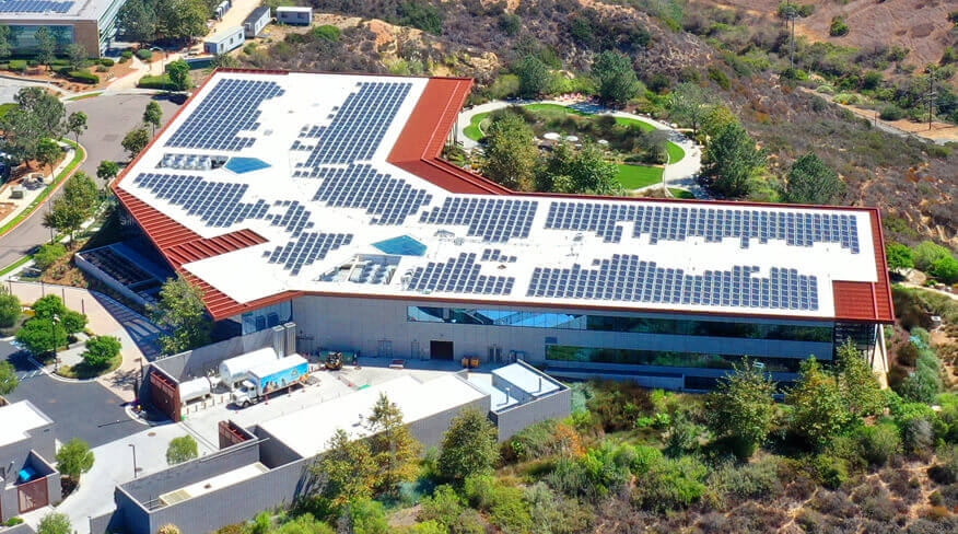 Aerial view of the roof of a building with solar panels