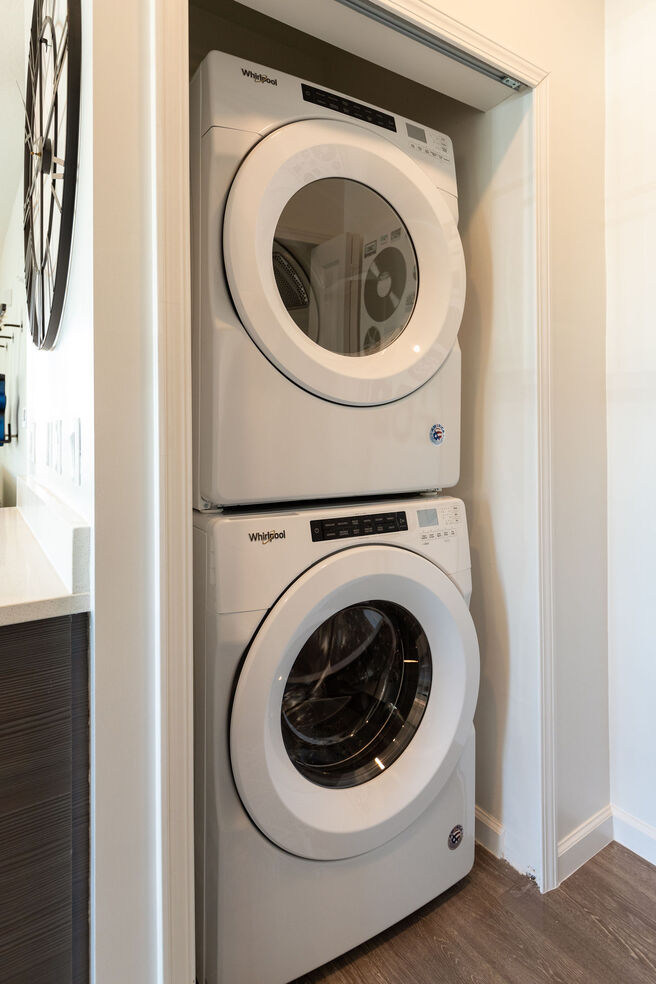 Laundry room with dryer and washing machine.