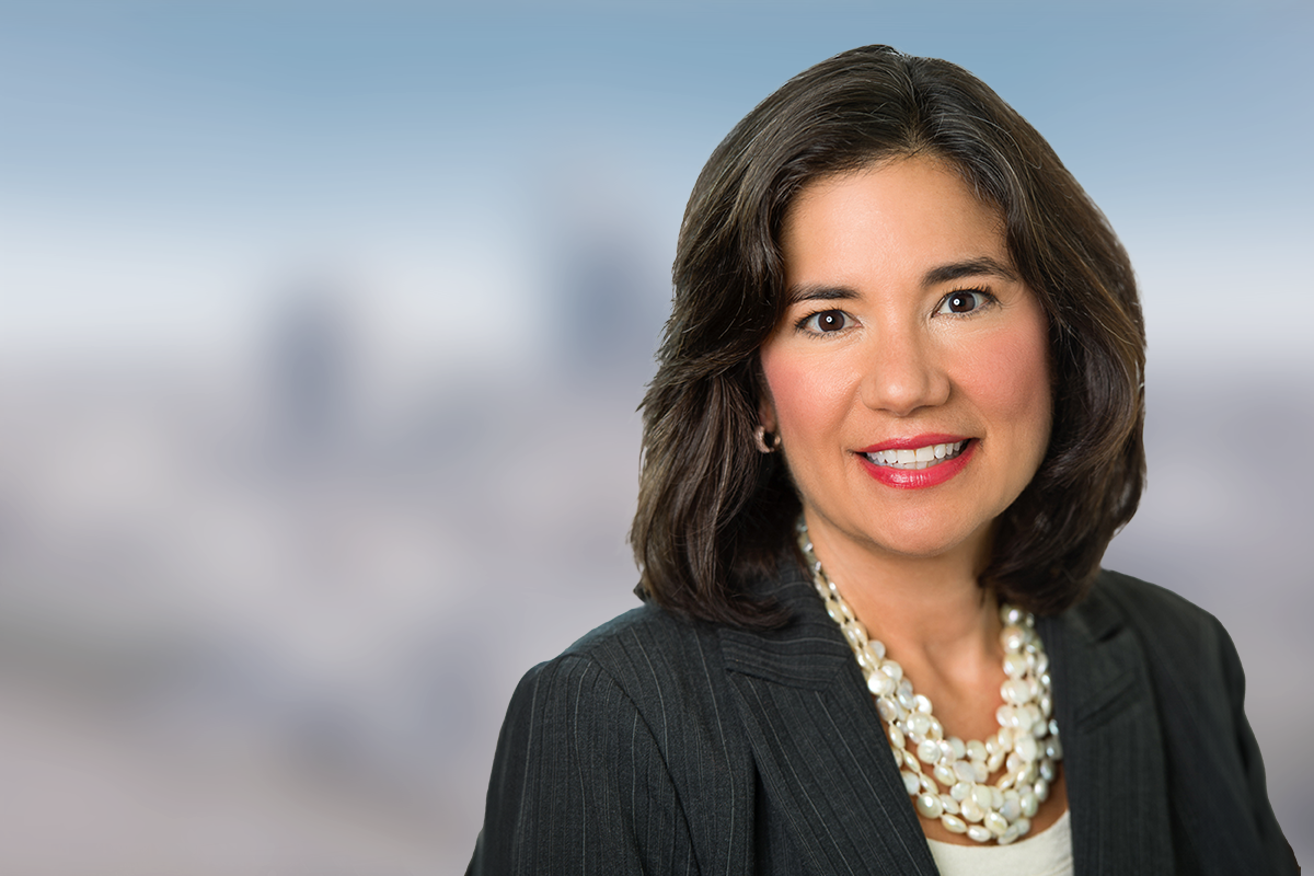 Portrait of Lisa Kaufman posing for the event agenda, with a blurred background.